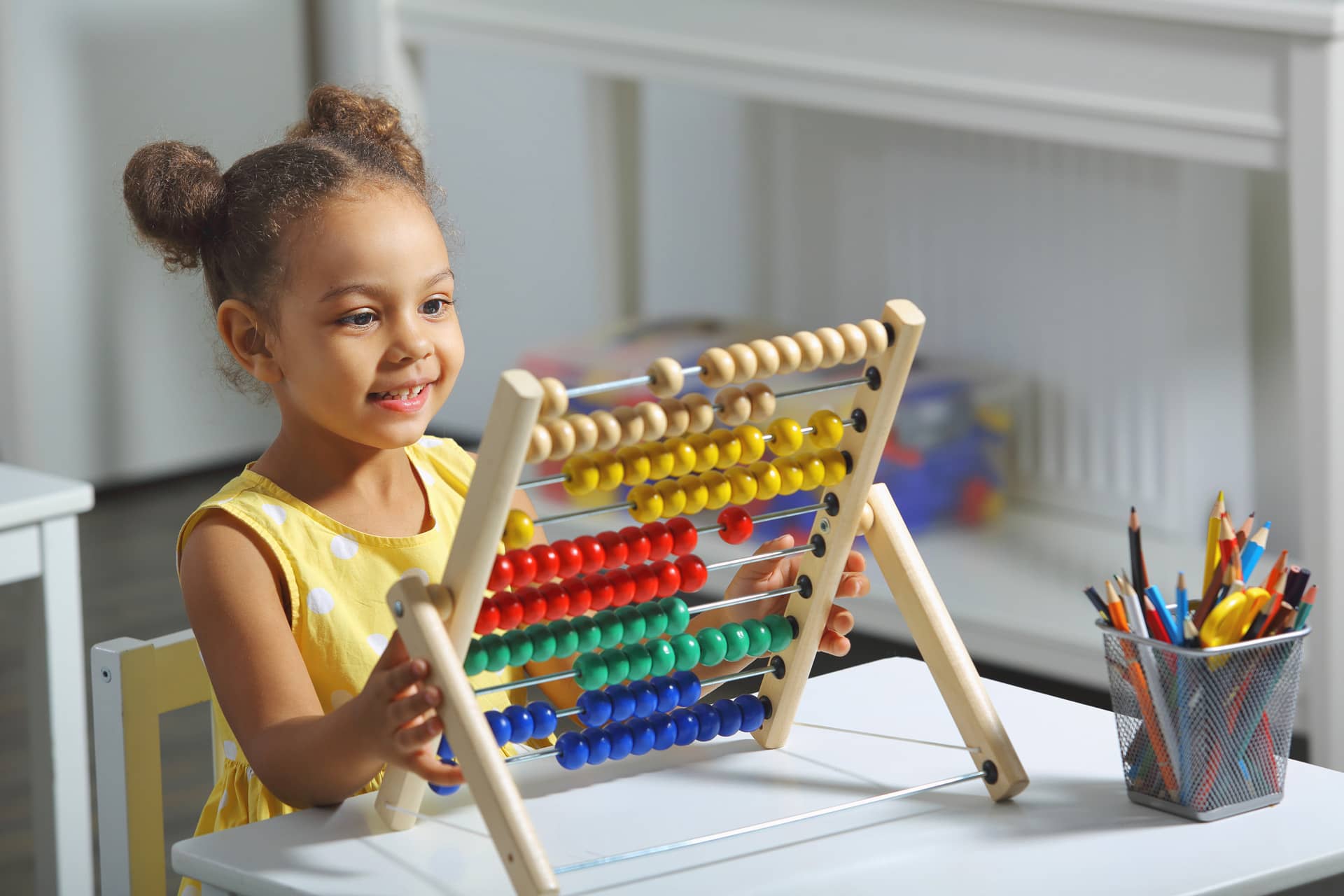 little girl playing with abacus